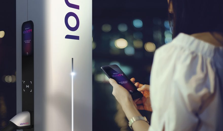 Woman Using Smartphone On The Street At Night